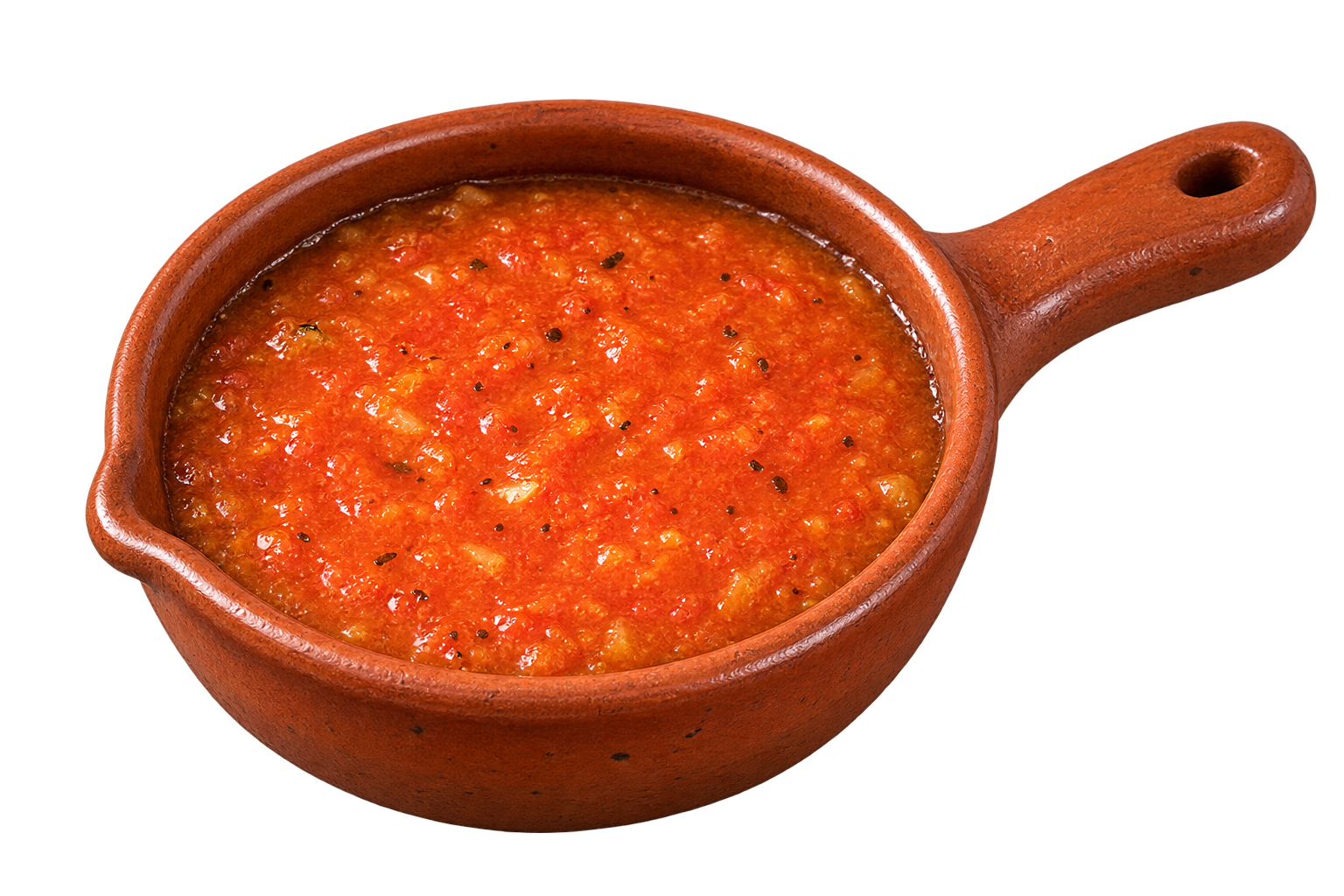 Fresh salsa de molcajete in a traditional clay pot